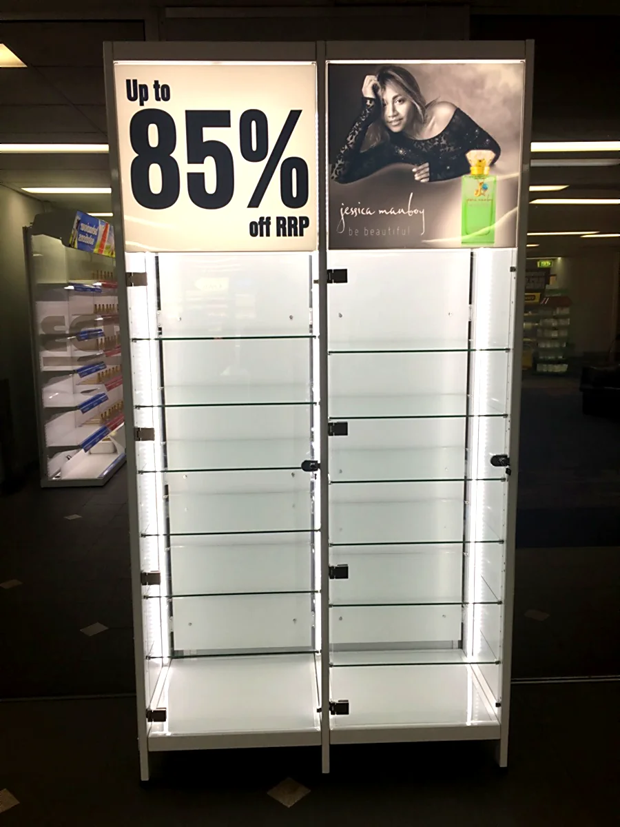 ULIGHT 1010 magnetic LED bar installed and lit on a multi-tier retail gondola shelf
